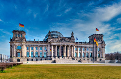 View of historical building against cloudy sky reichstag