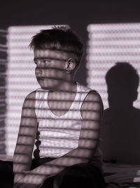 Portrait of young man sitting outdoors