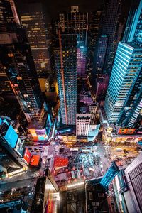 Aerial view of city lit up at night
