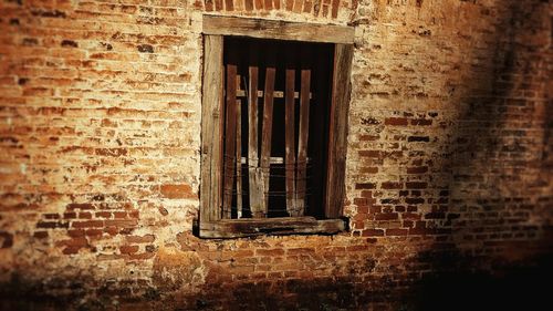 Close-up of window of abandoned building