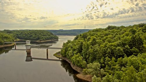 Scenic view of swimming pool by sea against sky