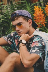 Close-up of young boy wearing sunglasses