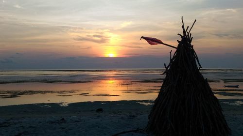 Scenic view of sea against sky at sunset