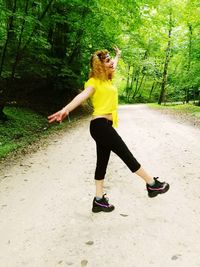 Full length of young woman in the forest