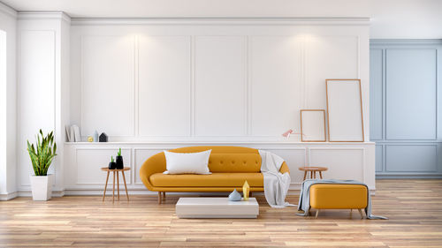 Modern mid century room interior , yellow sofa on white room
