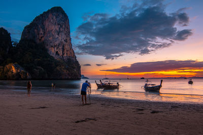 Scenic view of beach against sky during sunset