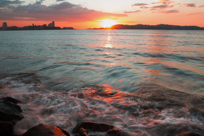 Scenic view of sea against sky during sunset