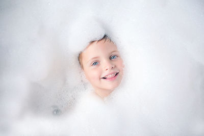 Portrait of smiling boy in water