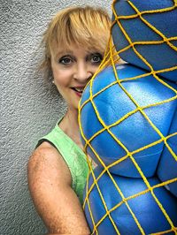 Portrait of smiling woman holding buoy