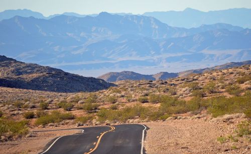 Country road leading towards mountains