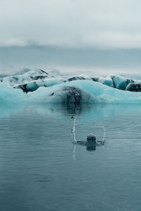 Scenic view of frozen sea against sky