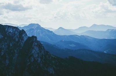 Scenic view of tatra mountains against cloudy sky