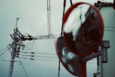 Low angle view of street light against sky