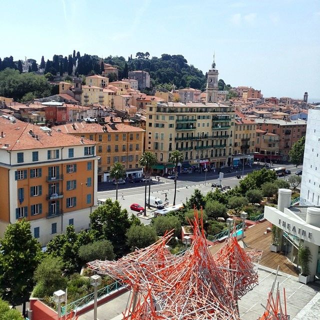 architecture, building exterior, built structure, city, high angle view, residential structure, residential building, residential district, roof, tree, house, street, cityscape, town, transportation, clear sky, sky, crowded, car, incidental people