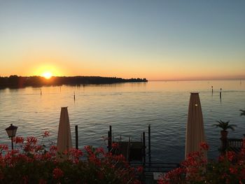 Scenic view of sea against clear sky during sunset