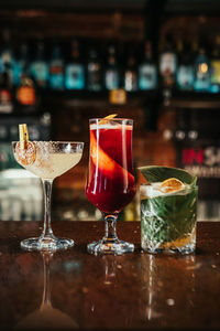 Close-up of wine glasses on table