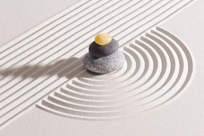 Stack stones on patterned sand