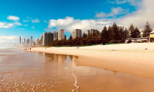 View of beach with city in background