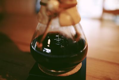 Close-up of beer glass on table