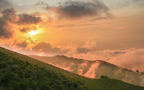 Scenic view of mountains against sky during sunset