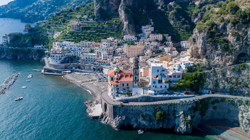 High angle view of townscape by sea