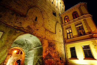 Low angle view of illuminated building at night