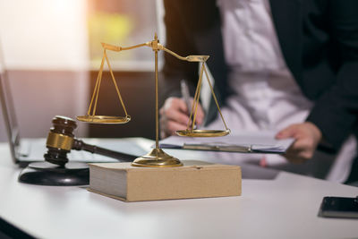 Close-up of man with eyeglasses on table