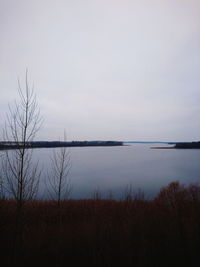 Scenic view of lake against sky at dusk