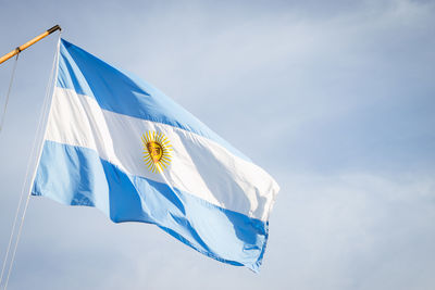 Low angle view of flag against sky