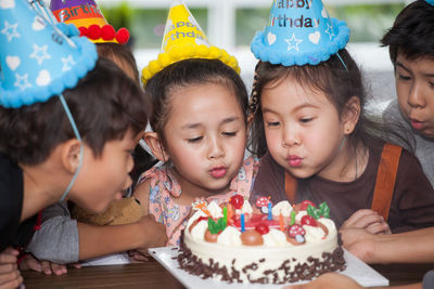 Students celebrating birthday in classroom at school