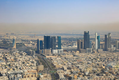 High angle view of modern buildings in city against clear sky