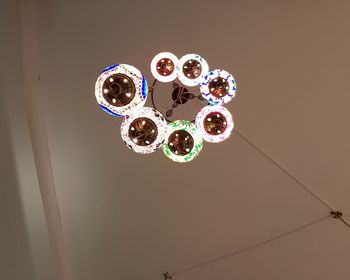 Low angle view of illuminated lighting equipment