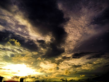 Low angle view of dramatic sky during sunset