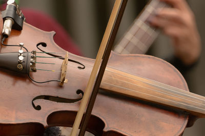 Midsection of musicians performing on street