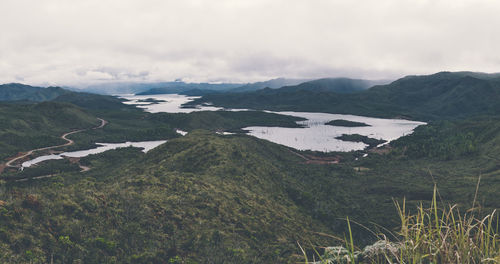 Scenic view of landscape and mountains against sky