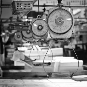 Weight scales hanging in row at factory