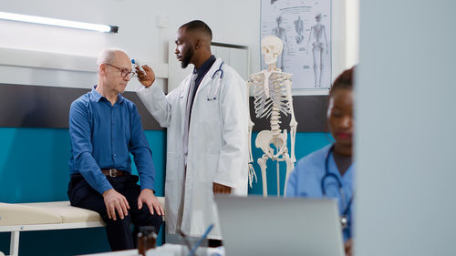 Female doctor examining x-ray