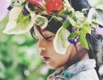 Close-up of young woman with flowers