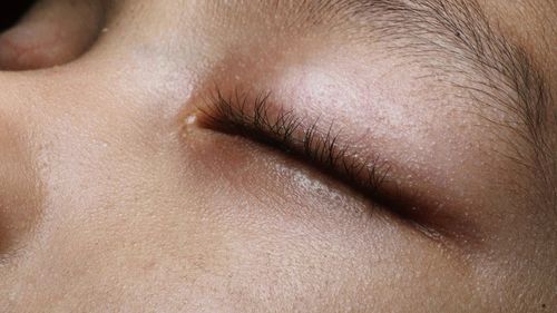 Full frame shot of young woman with eyes closed