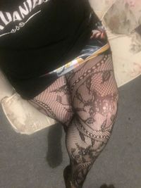 Low section of woman wearing shoes