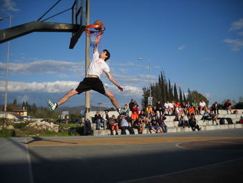 Full length of woman jumping in mid-air