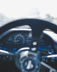 Close-up of steering wheel in car