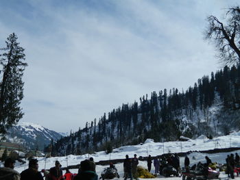 People on snow covered landscape