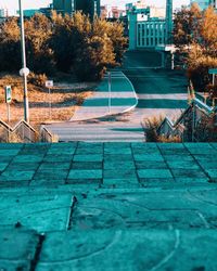 Footpath by swimming pool in city