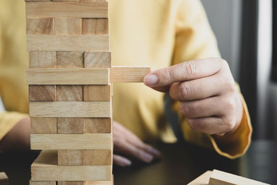 Close-up of man working on wood