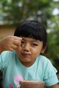 Portrait of asian girl sitting in cafe