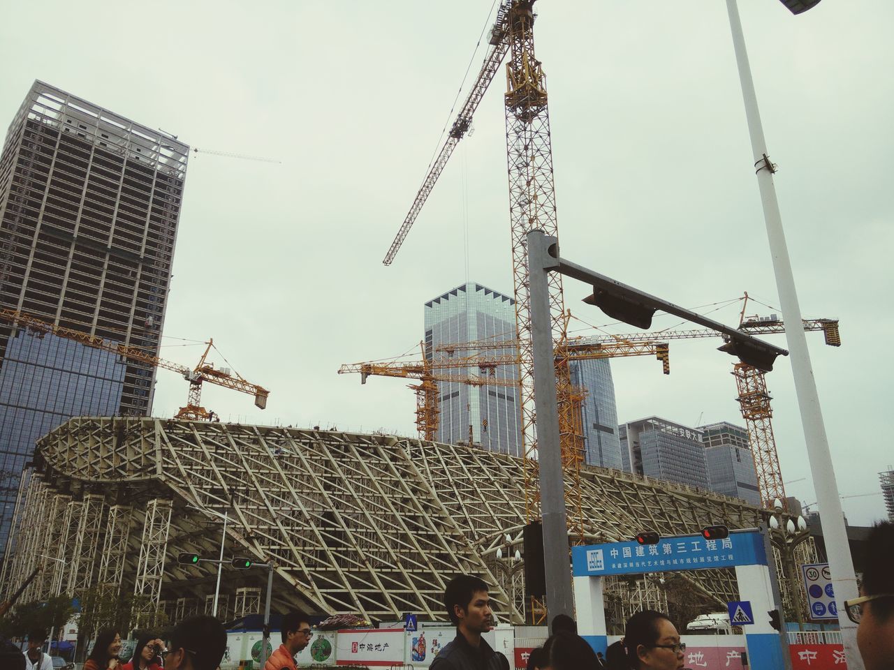 built structure, building exterior, architecture, tall - high, construction site, tower, low angle view, crane - construction machinery, sky, city, development, crane, travel destinations, arts culture and entertainment, construction industry, tourism, construction, capital cities, famous place