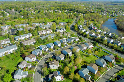 High angle view of trees and buildings in city