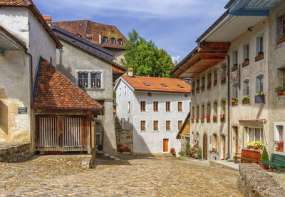 Main street in gruyere village in fribourg canton by beautiful day, switzerland