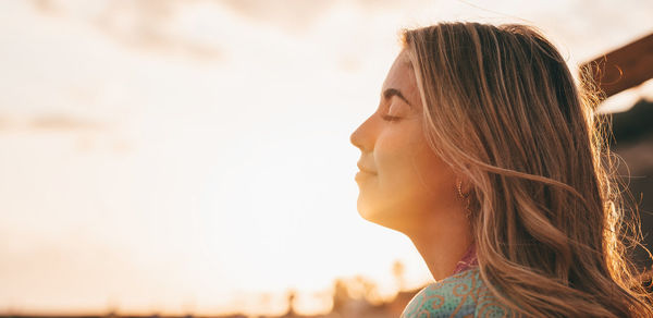 Close-up of young woman looking away